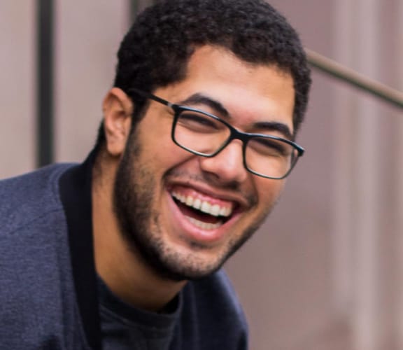 Man sitting on stairs and laughing